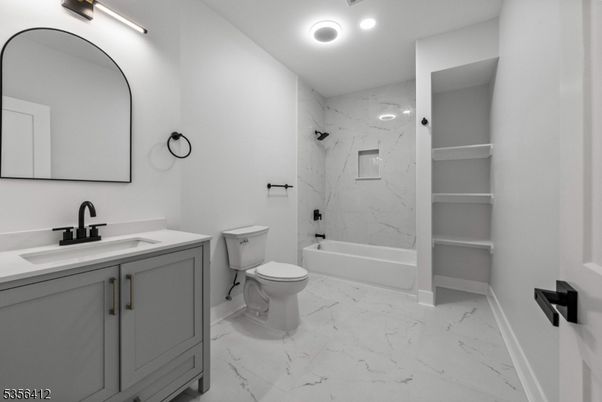 Bathroom, Dual Sink Vanities, Interior, Marble, Marble Walls, Recessed Lighting