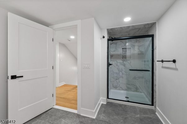 Bathroom, Glass Shower, Interior, Marble Walls, Recessed Lighting, Wood Texture Flooring