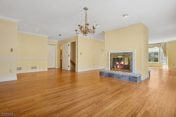 Chandelier, Empty room, Fireplace, Interior, Recessed Lighting, Wood Texture Flooring