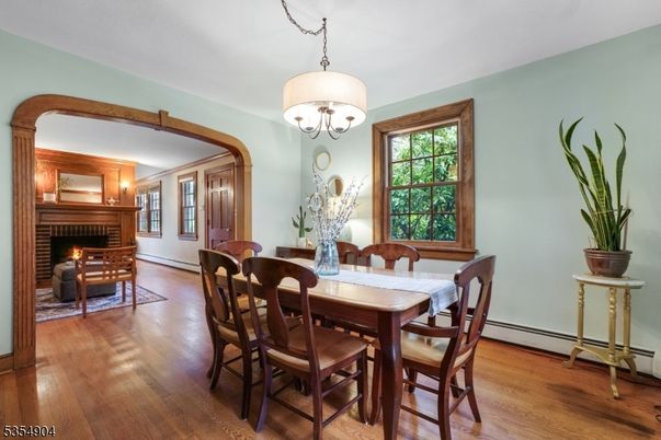 Chandelier, Dining room, Fireplace, Interior, Wood Texture Flooring