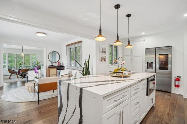 Dining room, Interior, Kitchen, Living room, Pendant Lights, Recessed Lighting, Stainless Steel Appliances, Wood Texture Flooring