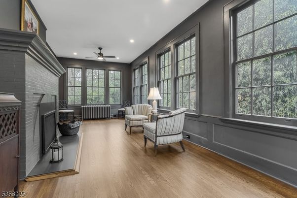 Fireplace, Interior, Living room, Recessed Lighting, Stone Walls, Wood Texture Flooring