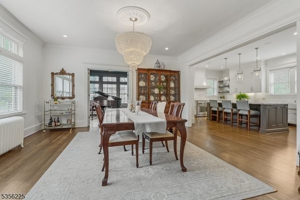 Chandelier, Dining room, Interior, Kitchen, Pendant Lights, Piano, Recessed Lighting, Wood Texture Flooring