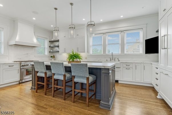 Interior, Kitchen, Marble Walls, Pendant Lights, Recessed Lighting, Stainless Steel Appliances, Wood Texture Flooring