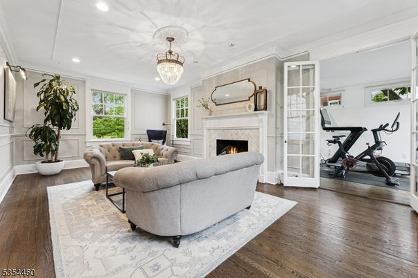 Chandelier, Fireplace, Fitness Equipment, Interior, Living room, Recessed Lighting, Wood Texture Flooring