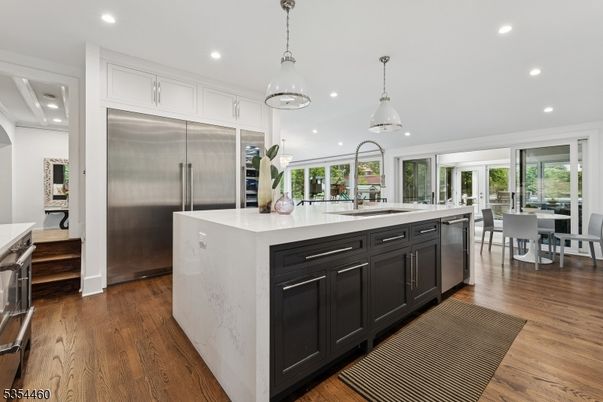 Dining room, Interior, Kitchen, Pendant Lights, Recessed Lighting, Stainless Steel Appliances, Wood Texture Flooring