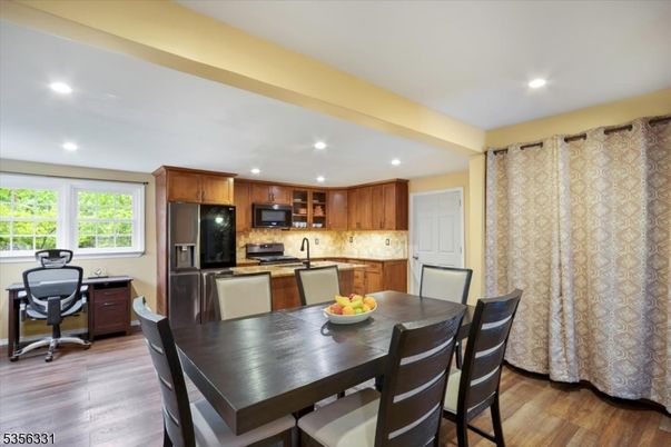 Dining room, Interior, Kitchen, Recessed Lighting, Stainless Steel Appliances, Wood Texture Flooring