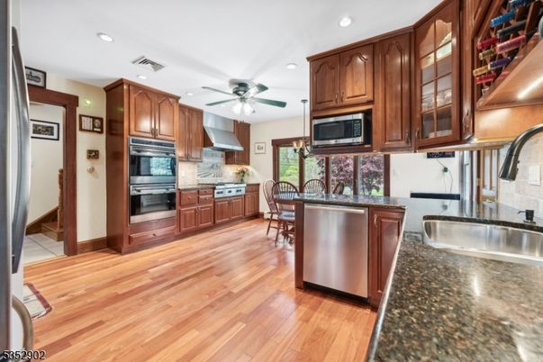 Dining room, Interior, Kitchen, Recessed Lighting, Stainless Steel Appliances, Wood Texture Flooring