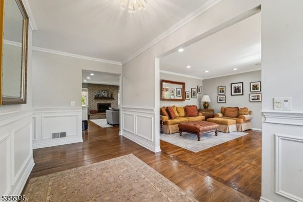 Fireplace, Interior, Living room, Recessed Lighting, Stone Walls, Wood Texture Flooring