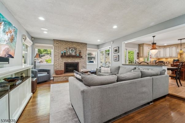 Dining room, Fireplace, Interior, Kitchen, Living room, Pendant Lights, Recessed Lighting, Stone Walls, Wood Texture Flooring