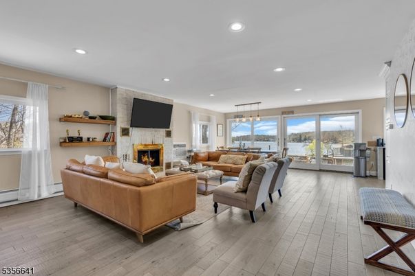 Fireplace, Interior, Living room, Pendant Lights, Recessed Lighting, Stone Walls, Wood Texture Flooring
