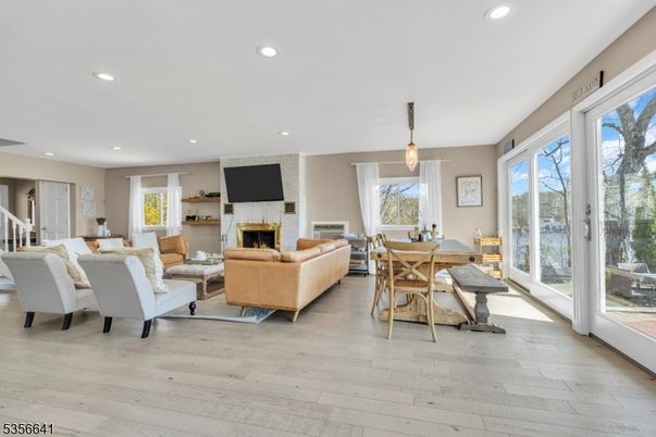 Dining room, Fireplace, Interior, Living room, Pendant Lights, Recessed Lighting, Wood Texture Flooring