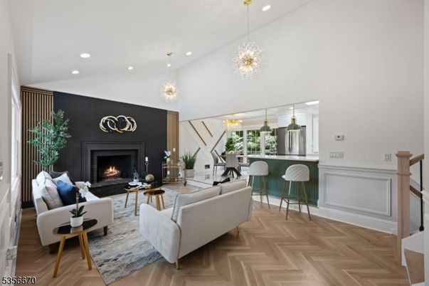 Chandelier, Fireplace, Interior, Living room, Pendant Lights, Recessed Lighting, Wood Texture Flooring