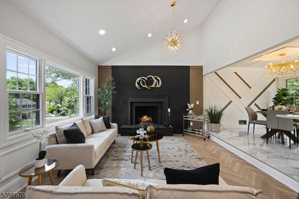 Chandelier, Dining room, Fireplace, Interior, Living room, Pendant Lights, Recessed Lighting, Wood Texture Flooring