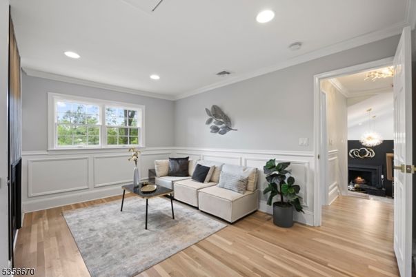Chandelier, Fireplace, Interior, Living room, Recessed Lighting, Wood Texture Flooring