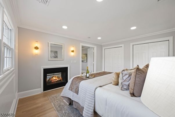 Bedroom, Fireplace, Interior, Recessed Lighting, Wood Texture Flooring