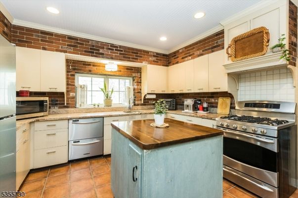 Interior, Kitchen, Recessed Lighting, Stainless Steel Appliances, Stone Walls