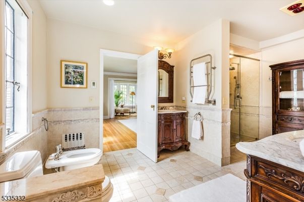 Bathroom, Dual Sink Vanities, Glass Shower, Interior, Recessed Lighting, Wood Texture Flooring