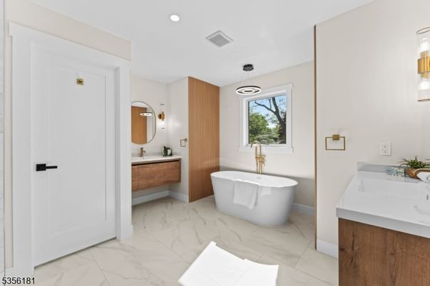 Bathroom, Dual Sink Vanities, Free Standing Baths, Interior, Marble, Pendant Lights, Recessed Lighting