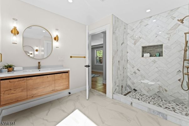 Bathroom, Dual Sink Vanities, Glass Shower, Interior, Marble, Marble Walls, Recessed Lighting, Wood Texture Flooring