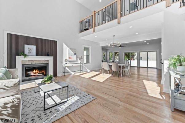 Dining room, Fireplace, Interior, Living room, Pendant Lights, Recessed Lighting, Wood Texture Flooring
