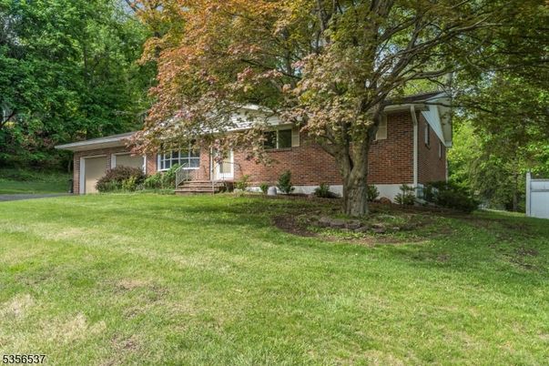 Attached, Backyard, Exterior, Facade, Brick Facade, None