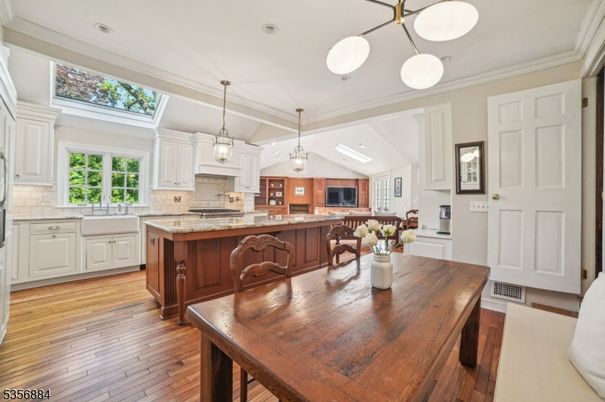 Dining room, Interior, Kitchen, Living room, Pendant Lights, Recessed Lighting, Tile Countertops, Wood Texture Flooring