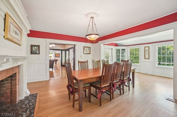 Dining room, Fireplace, Interior, Pendant Lights, Wood Texture Flooring
