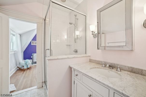 Bathroom, Dual Sink Vanities, Glass Shower, Interior, Wood Texture Flooring