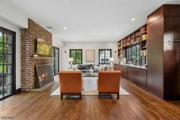Fireplace, Interior, Living room, Recessed Lighting, Stone Walls, Wood Texture Flooring