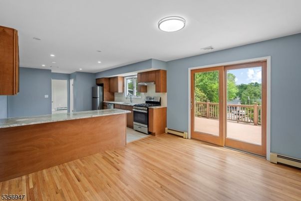 Interior, Kitchen, Recessed Lighting, Stainless Steel Appliances, Wood Texture Flooring
