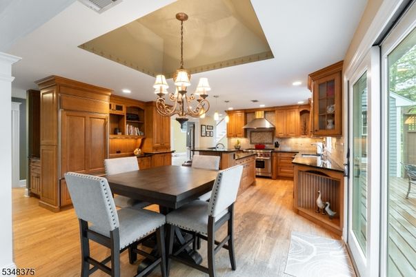 Chandelier, Dining room, Interior, Kitchen, Recessed Lighting, Stainless Steel Appliances, Wood Texture Flooring