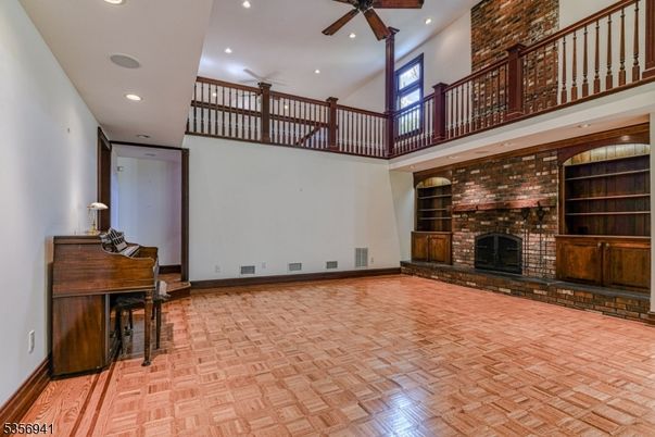 Fireplace, Interior, Piano, Recessed Lighting, Stone Walls, Wood Texture Flooring
