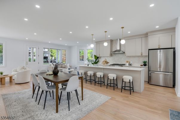 Dining room, Interior, Kitchen, Pendant Lights, Recessed Lighting, Stainless Steel Appliances, Wood Texture Flooring