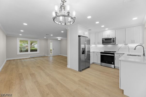 Chandelier, Interior, Kitchen, Recessed Lighting, Stainless Steel Appliances, Wood Texture Flooring