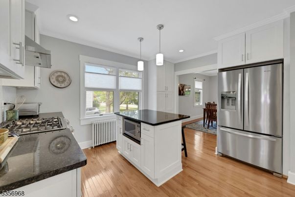 Dining room, Interior, Kitchen, Pendant Lights, Recessed Lighting, Stainless Steel Appliances, Wood Texture Flooring