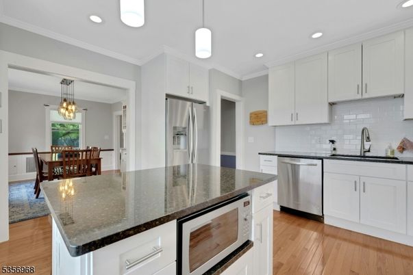 Dining room, Interior, Kitchen, Pendant Lights, Recessed Lighting, Stainless Steel Appliances, Wood Texture Flooring