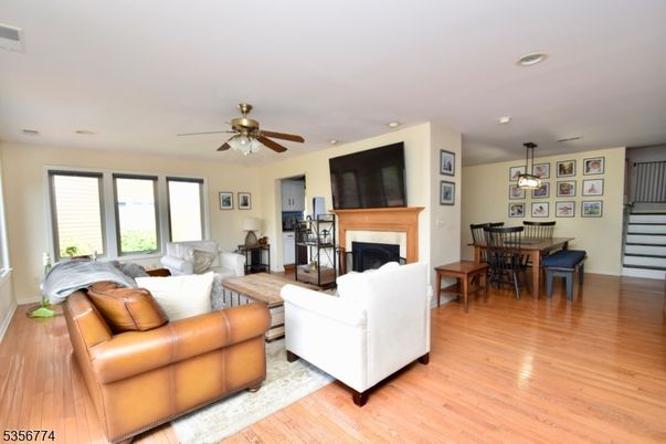 Dining room, Fireplace, Interior, Living room, Pendant Lights, Recessed Lighting, Wood Texture Flooring