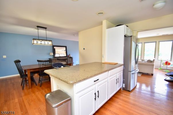Dining room, Fireplace, Interior, Kitchen, Living room, Pendant Lights, Recessed Lighting, Wood Texture Flooring