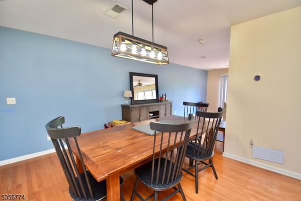 Dining room, Fireplace, Interior, Pendant Lights, Wood Texture Flooring