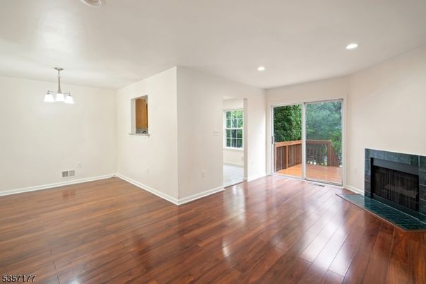 Empty room, Fireplace, Interior, Pendant Lights, Recessed Lighting, Wood Texture Flooring