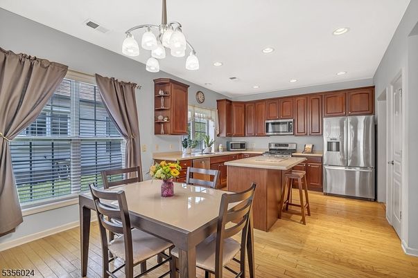 Dining room, Interior, Kitchen, Recessed Lighting, Stainless Steel Appliances, Wood Texture Flooring