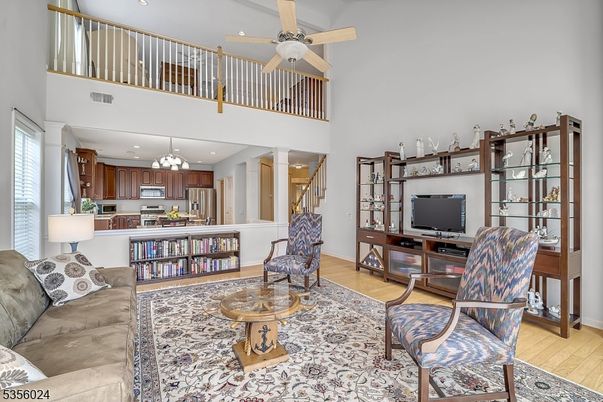 Chandelier, Interior, Kitchen, Living room, Recessed Lighting, Stainless Steel Appliances, Wood Texture Flooring