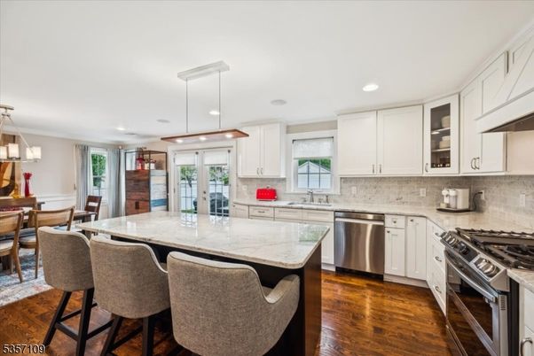 Dining room, Interior, Kitchen, Pendant Lights, Recessed Lighting, Stainless Steel Appliances, Wood Texture Flooring