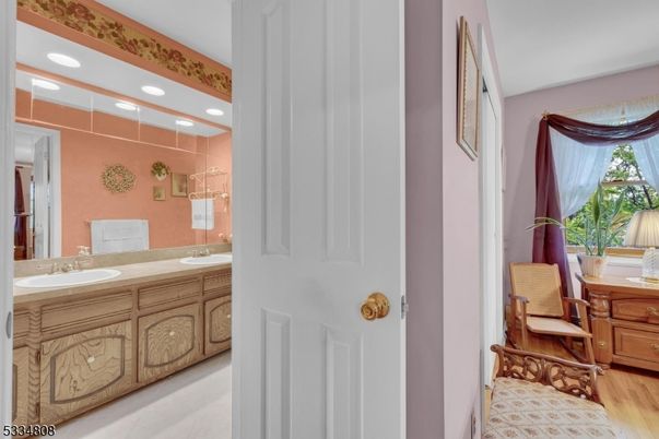 Bathroom, Dual Sink Vanities, Interior, Recessed Lighting, Wood Texture Flooring
