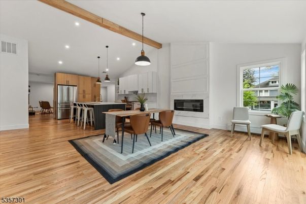 Dining room, Fireplace, Interior, Kitchen, Pendant Lights, Recessed Lighting, Stainless Steel Appliances, Wooden Beams, Wood Texture Flooring
