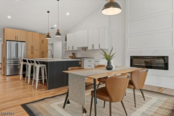 Dining room, Interior, Kitchen, Pendant Lights, Recessed Lighting, Stainless Steel Appliances, Wood Texture Flooring