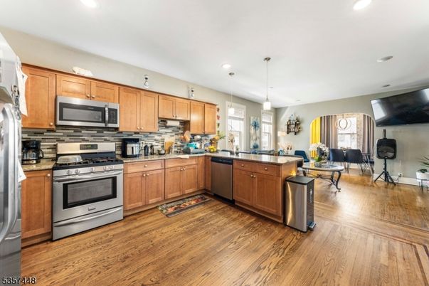 Dining room, Interior, Kitchen, Pendant Lights, Recessed Lighting, Stainless Steel Appliances, Wood Texture Flooring
