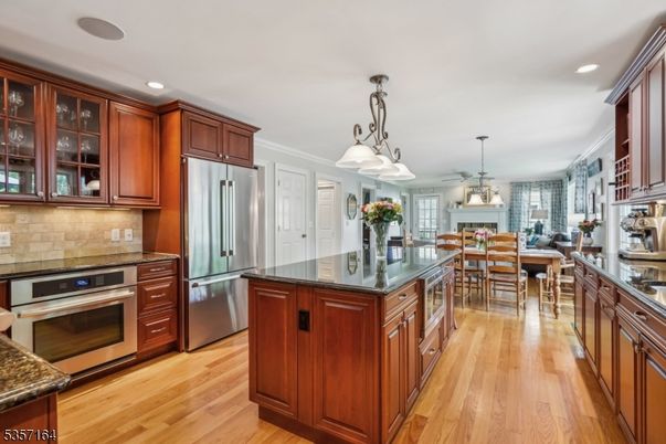Chandelier, Dining room, Interior, Kitchen, Pendant Lights, Recessed Lighting, Stainless Steel Appliances, Wood Texture Flooring