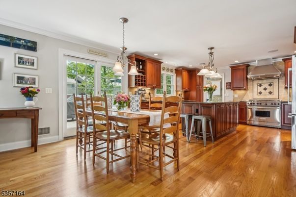 Dining room, Interior, Kitchen, Pendant Lights, Recessed Lighting, Stainless Steel Appliances, Wood Texture Flooring